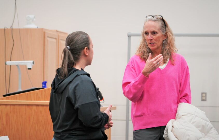 Bemidji High School activities director Kristen McRae, right, and Bemidji State athletic director Britt Lauritsen chat after meeting before a speaker panel on Wednesday, Feb. 1, 2023, in the Beaver Pride Room.