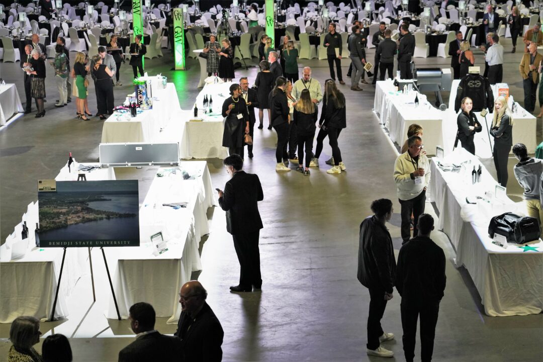 Attendees browse the silent auction items during the Green & White Dinner and Auction on Saturday, April 15, 2023, at the Sanford Center. (Brian Kortz / Bemidji State)