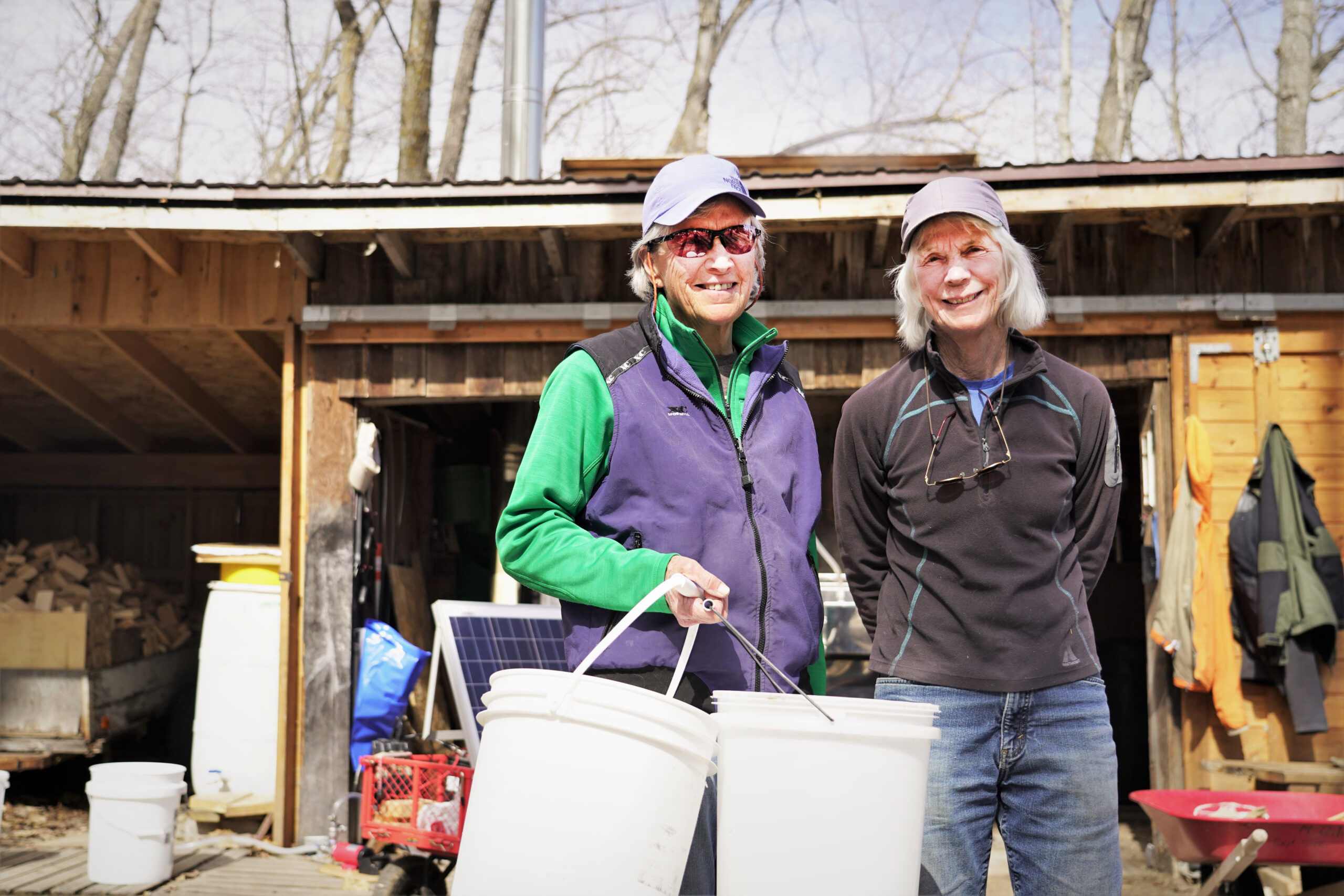 Donna Palivec, left, and Mur Gilman have a sweet gig: maple syruping. The two professors emeritae at Bemidji State University have discovered a rewarding passion in their springtime operation. (Micah Friez / Bemidji State)