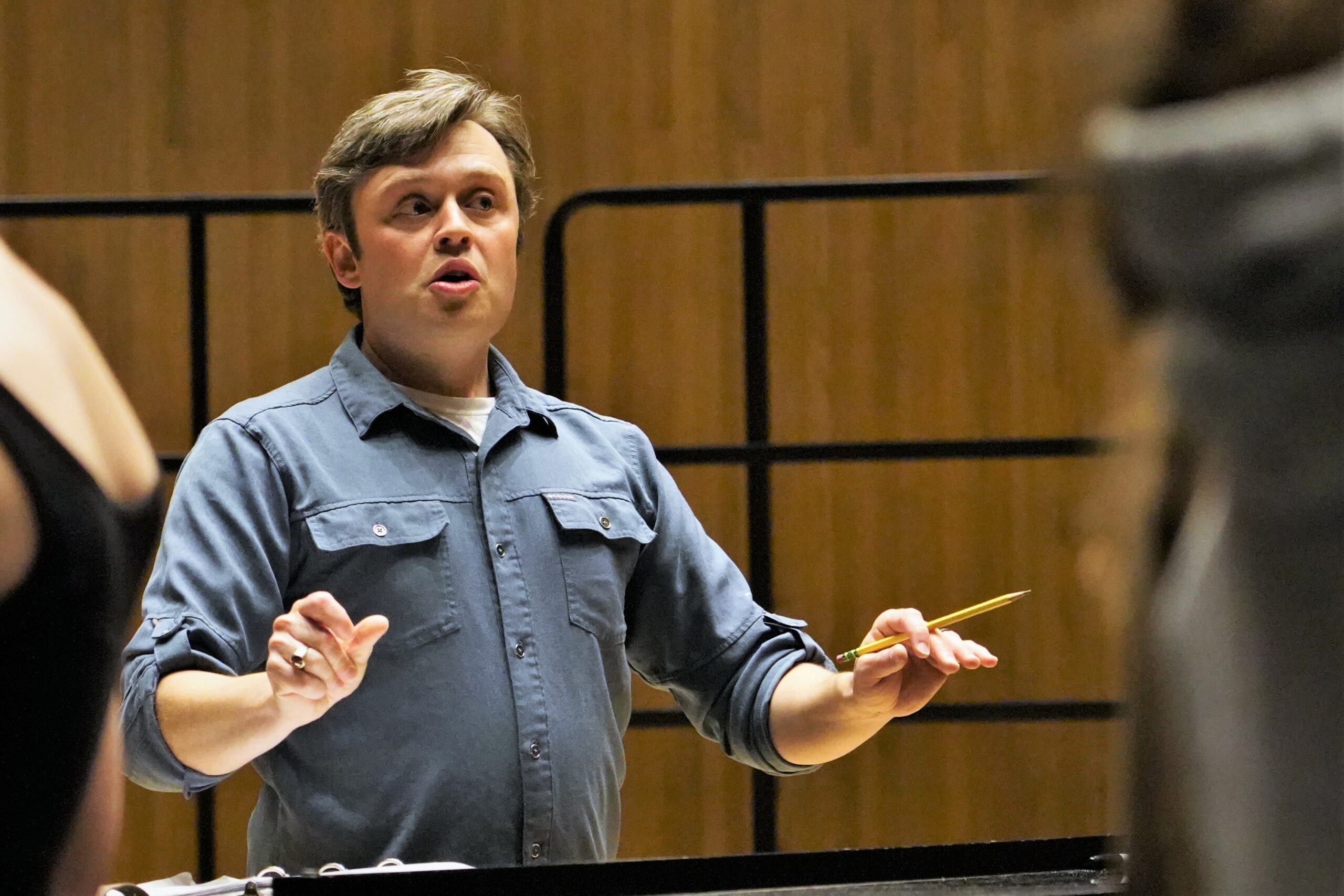 Instructor Charlie Moe, the choir director at Princeton High School and a MusiCamp volunteer, gives directions to campers on Wednesday, July 19, 2023, in Bangsberg Hall. (Micah Friez / Bemidji State)