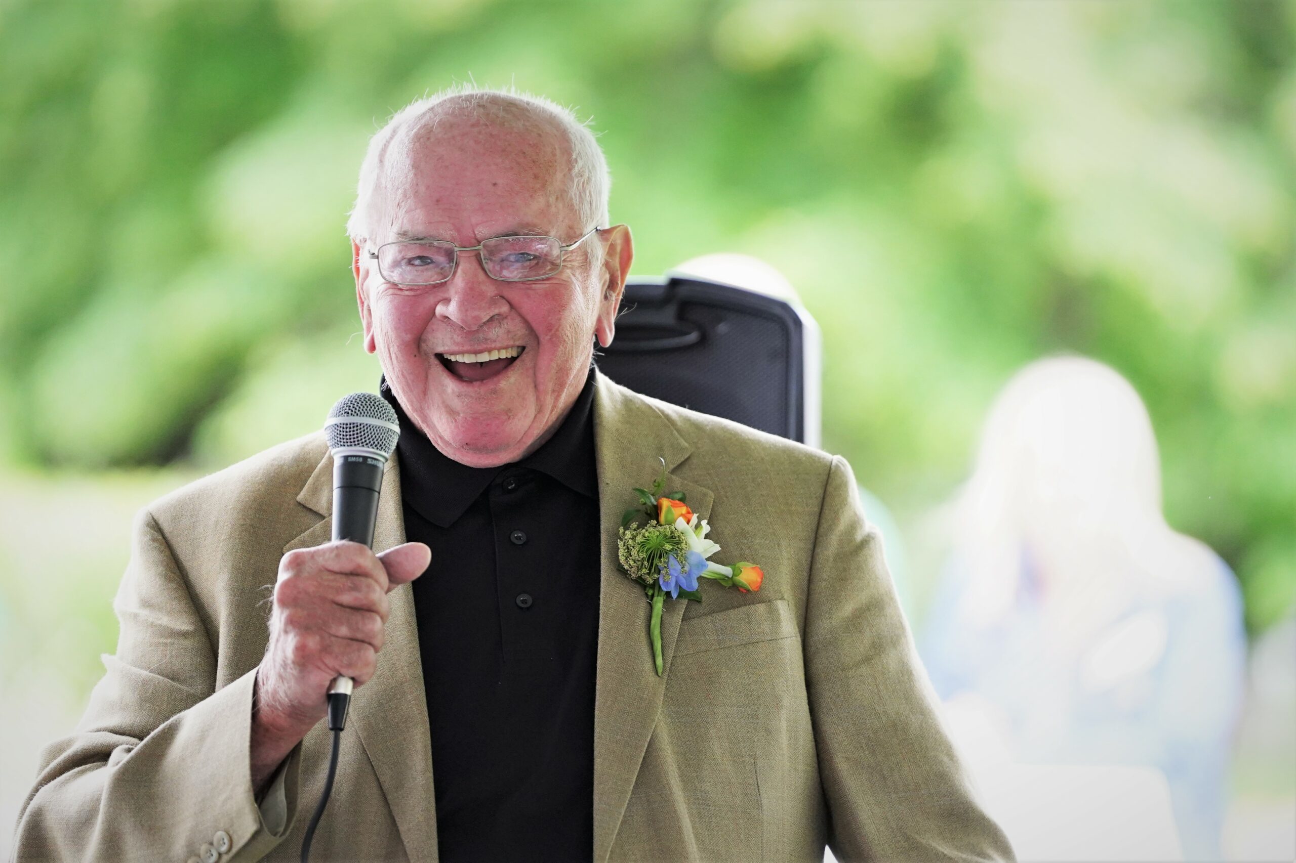 President Emeritus Jim Bensen laughs while delivering a speech during his send-off reception on Thursday, Aug. 10, 2023, at the David Park House. (Micah Friez / Bemidji State)