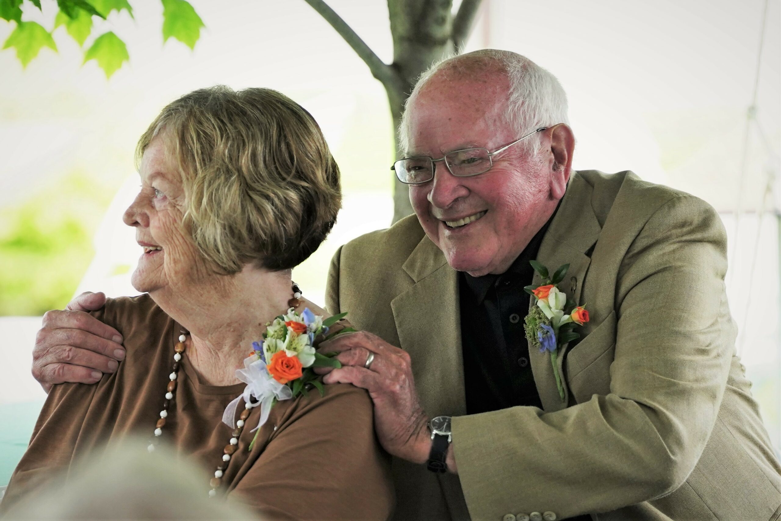 President Emeritus Jim Bensen, right, embraces his wife, Nancy, during their send-off reception on Thursday, Aug. 10, 2023, at the David Park House. (Micah Friez / Bemidji State)