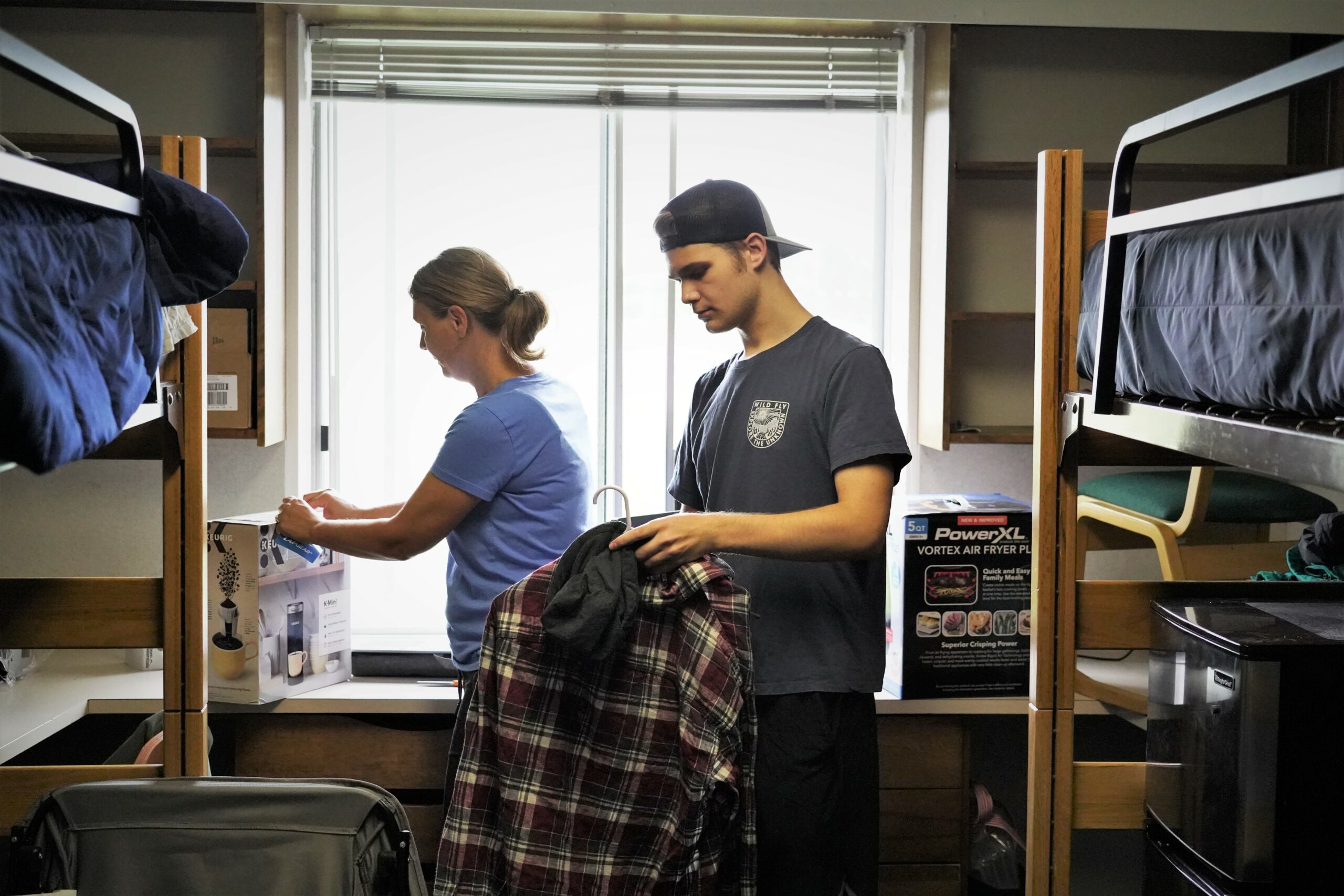 A student unpacks in his new dorm room inside Tamarack Hall during move-in day on campus on Thursday, Aug. 17, 2023. (Micah Friez / Bemidji State)
