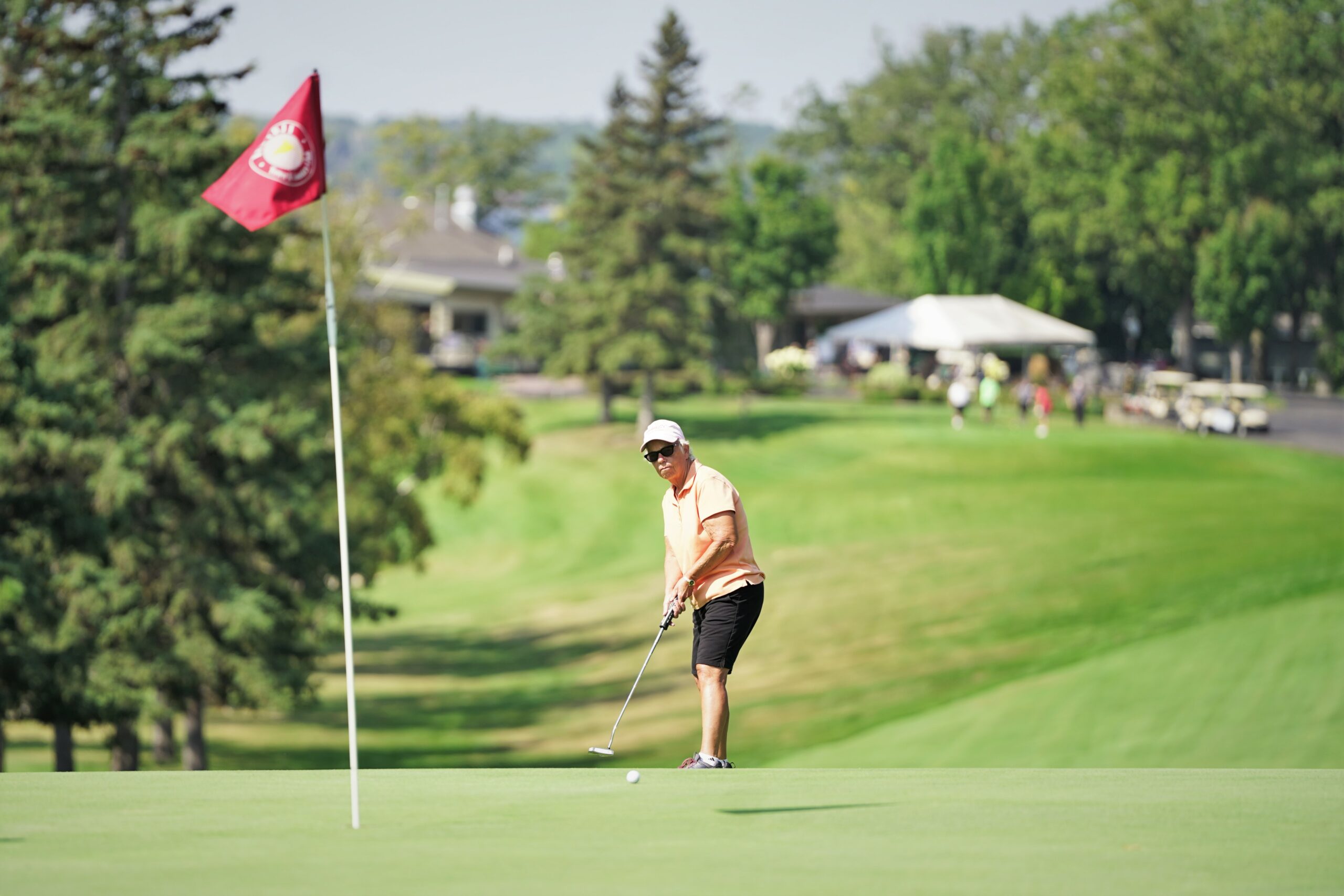 A golfer putts toward the pin on the first green during the Howe-Welle Women's Athletics Golf Tournament on Friday, Aug. 25, 2023, at the Bemidji Town and Country Club. (Micah Friez / Bemidji State)