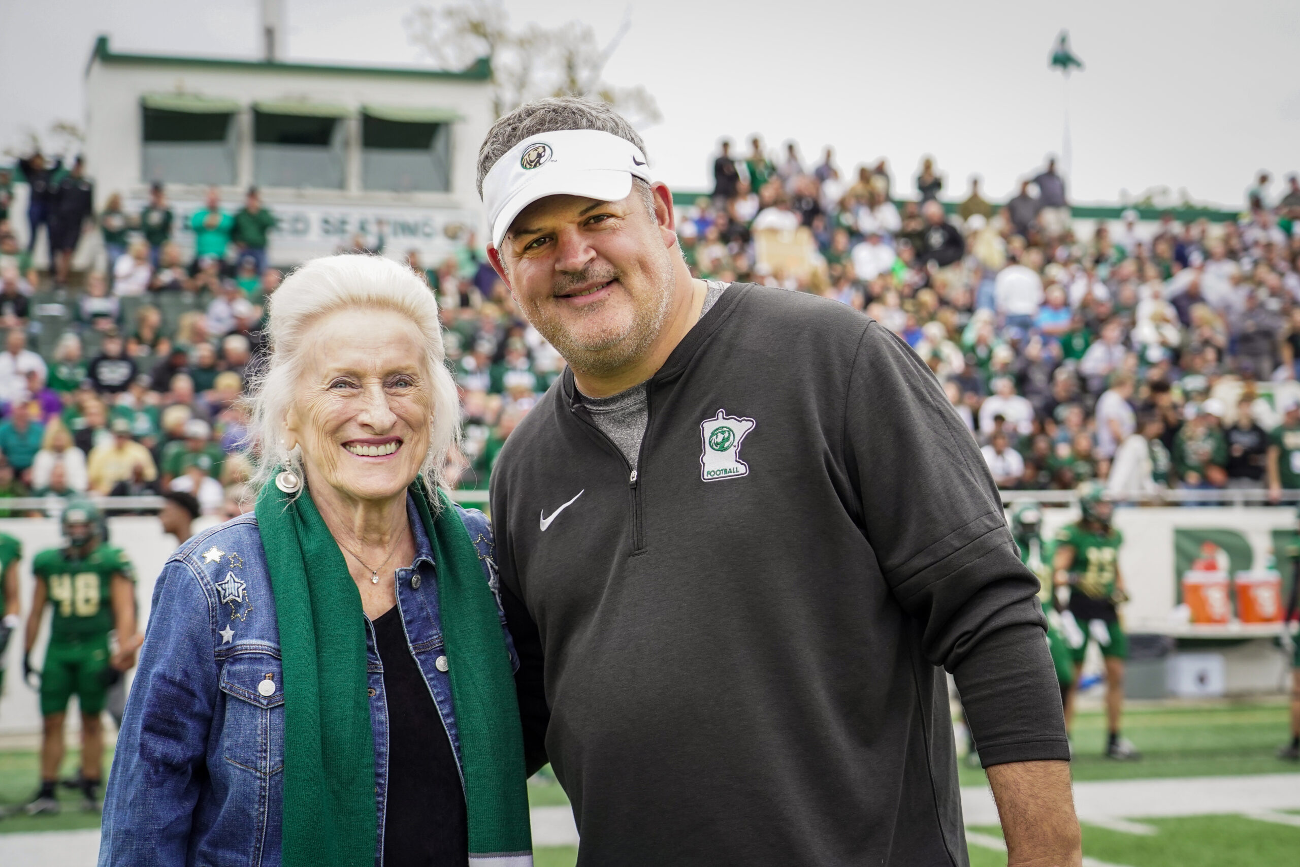 Margaret Laurich, left, with Bemidji State football head coach Brent Bolte before the Homecoming football game against Minnesota State on Saturday, Sept. 30, 2023, at Chet Anderson Stadium. (Micah Friez / Bemidji State)