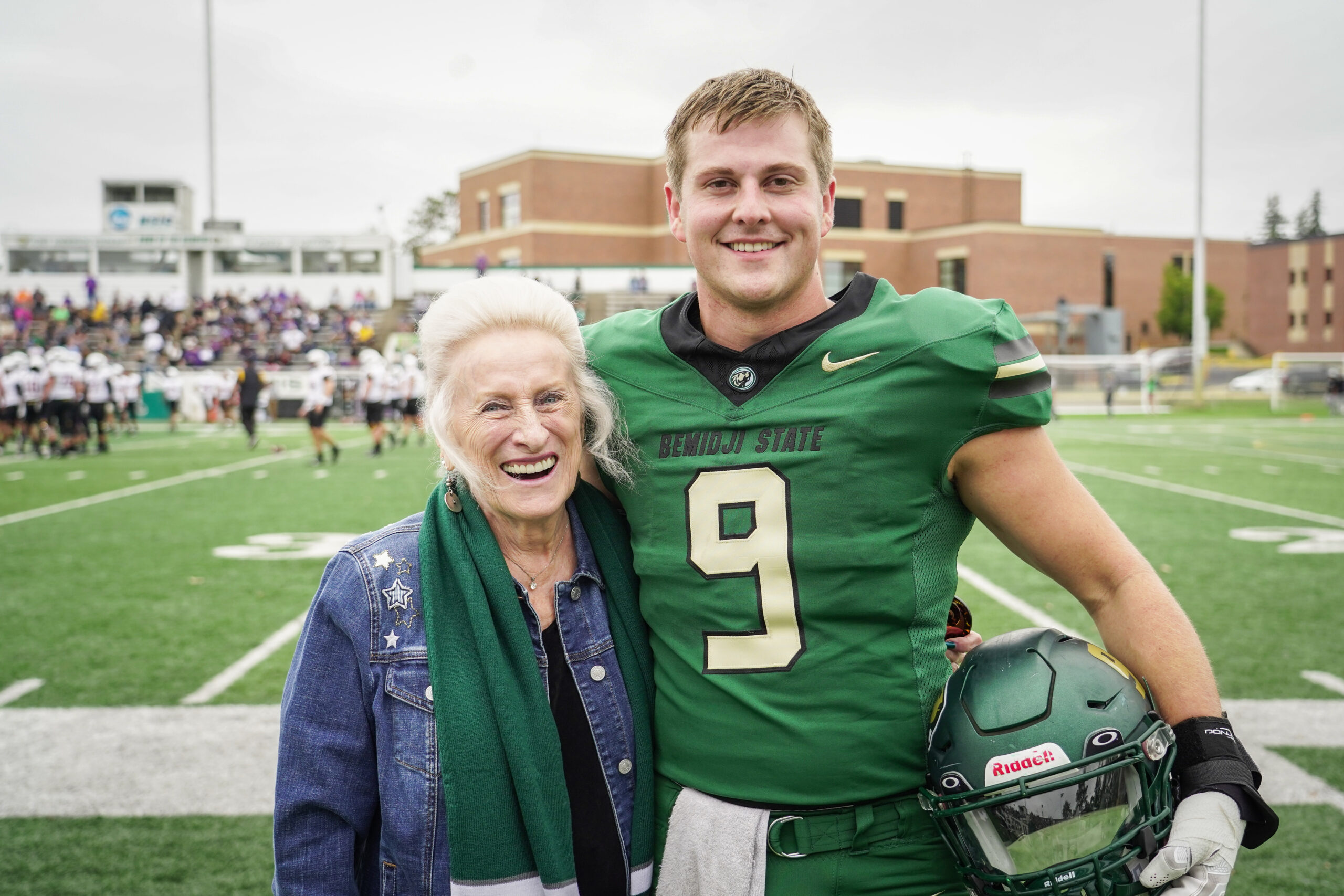 Margaret Laurich, left, with Bemidji State linebacker Spencer Wehr, her scholarship recipient, before the Homecoming football game against Minnesota State on Saturday, Sept. 30, 2023, at Chet Anderson Stadium. (Micah Friez / Bemidji State)