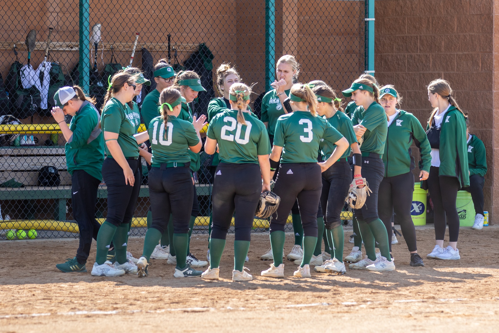 The Beavers huddle up during a 2023 game at the BSU softball field. (Courtesy / Candace Kessel)