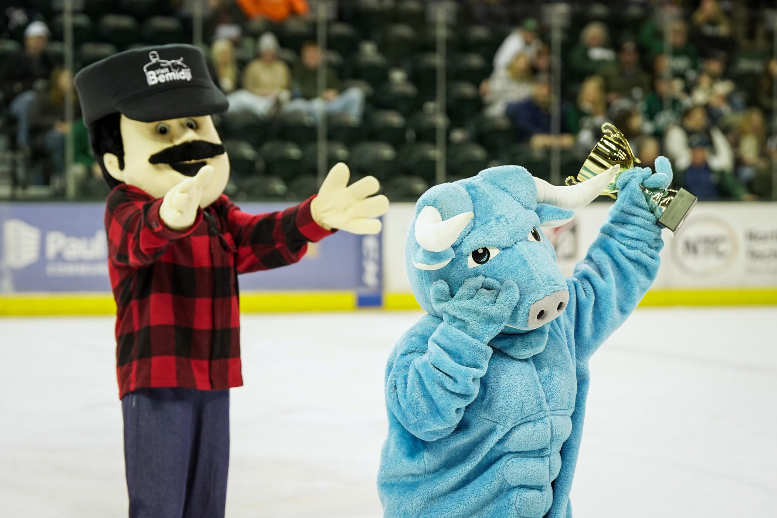 Babe the Blue Ox runs off the ice after stealing the Battle of the Mascots trophy on Saturday, Feb. 3, 2024, at the Sanford Center. (Micah Friez / Bemidji State)