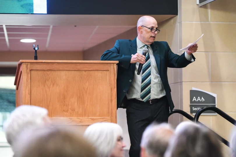 Bemidji State men's hockey head coach Tom Serratore speaks during an unveiling ceremony for a bust of R.H. "Bob" Peters at the Sanford Center on Thursday, Sept. 12, 2024, in Bemidji.Madelyn Haasken / Bemidji Pioneer