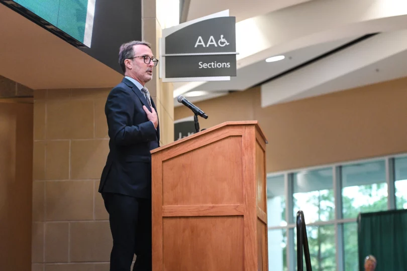 Steve Peters, son of the late Bemidji State men's hockey coach R.H. "Bob" Peters, speaks during an unveiling ceremony for a commemorative bust of his father at the Sanford Center on Thursday, Sept. 12, 2024, in Bemidji.Madelyn Haasken / Bemidji Pioneer