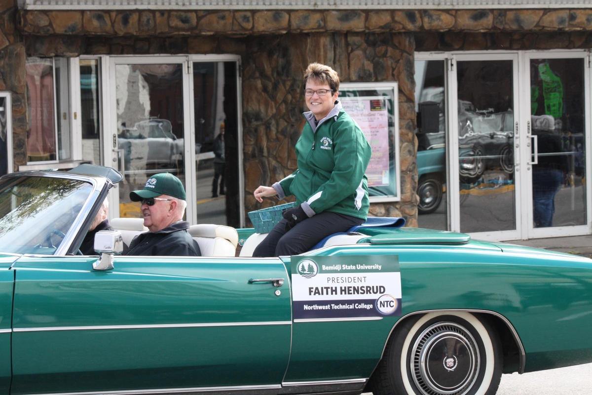 Neil Hensrud drives his wife, Faith, in the 2018 Homecoming parade through downtown Bemidji