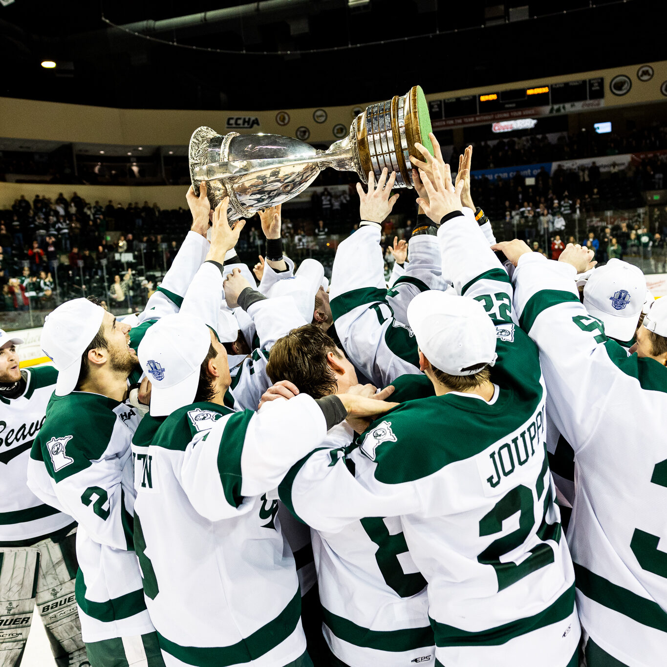 The Beavers celebrate with the MacNaughton Cup after winning the CCHA regular season championship on Friday, March 1, 2024, at the Sanford Center. (Courtesy / Brent Cizek Photography)